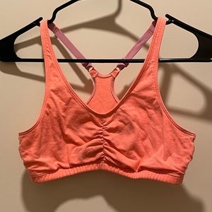 Sports Bra set
pink white and gray one has a tear on back 
fits small/medium